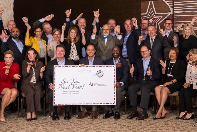 Board of Directors posing with "See you next year" sign